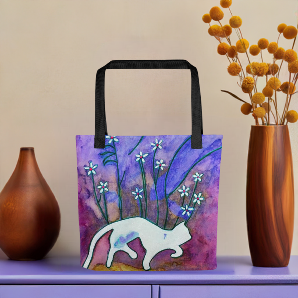 Sneaky Cat Tote Bag with white cat and floral artwork by Joy Calonico on purple background with black handles