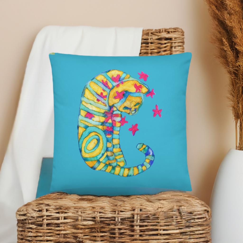 Dreamer Cat Pillow with colorful striped cat artwork on blue fabric, machine-washable polyester cover with shape-retaining insert.