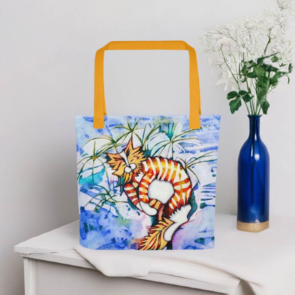 Orange Tabby Cat Tote bag with yellow handles and artistic cat design on blue background