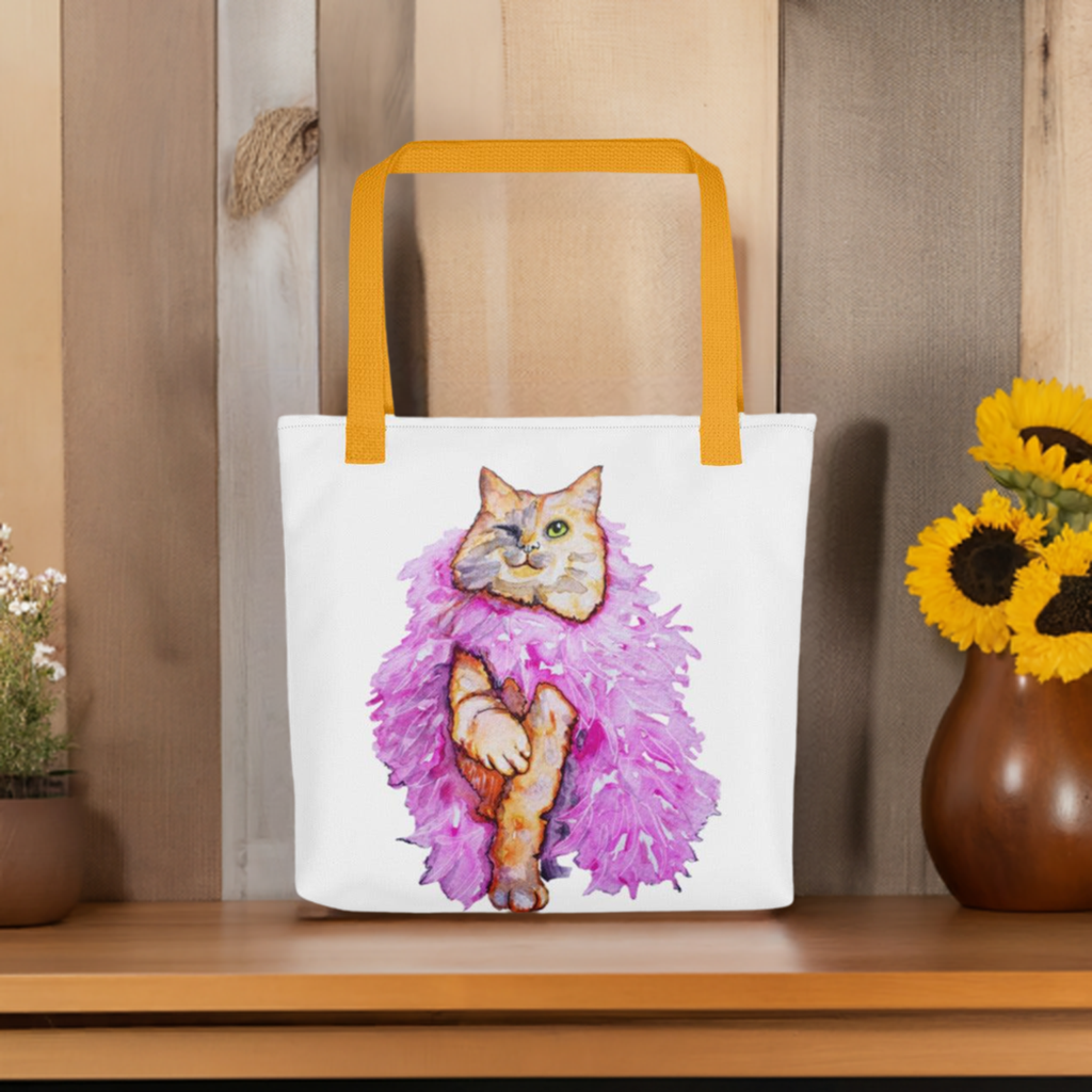 Boa Cat Wink Tote bag with colorful cat artwork and yellow handles on wooden shelf with flowers