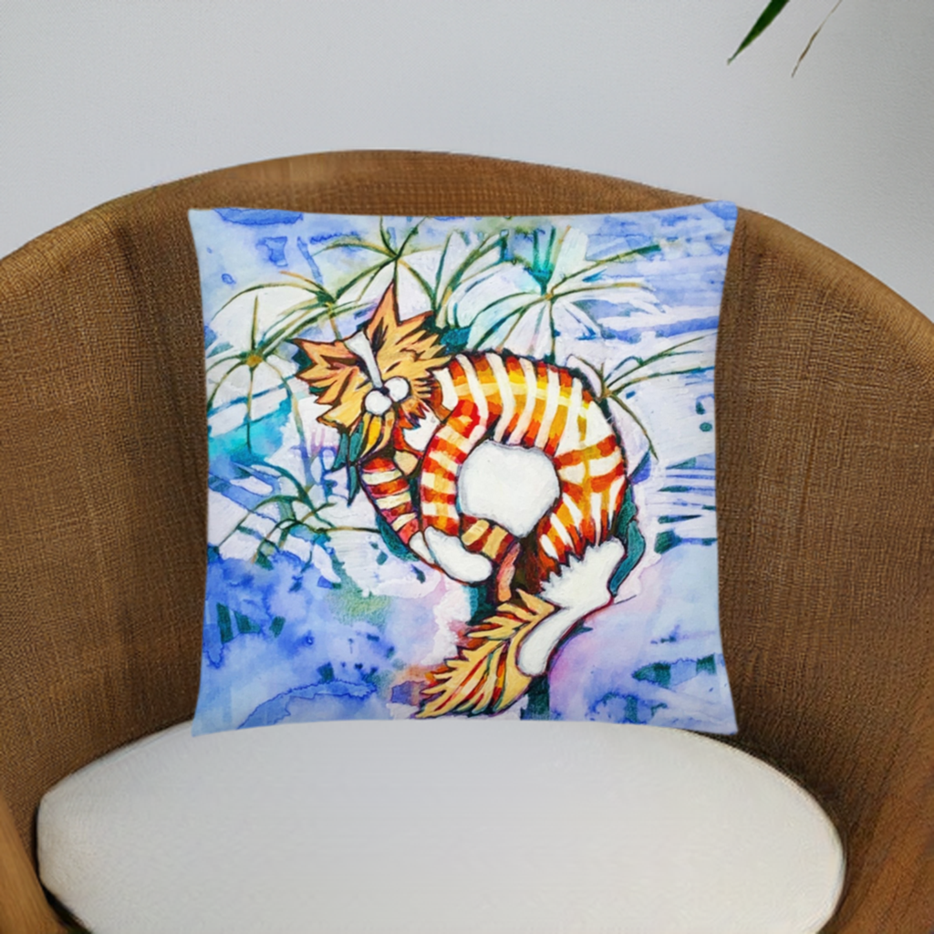 Orange tabby cat pillow with colorful artistic design on a chair