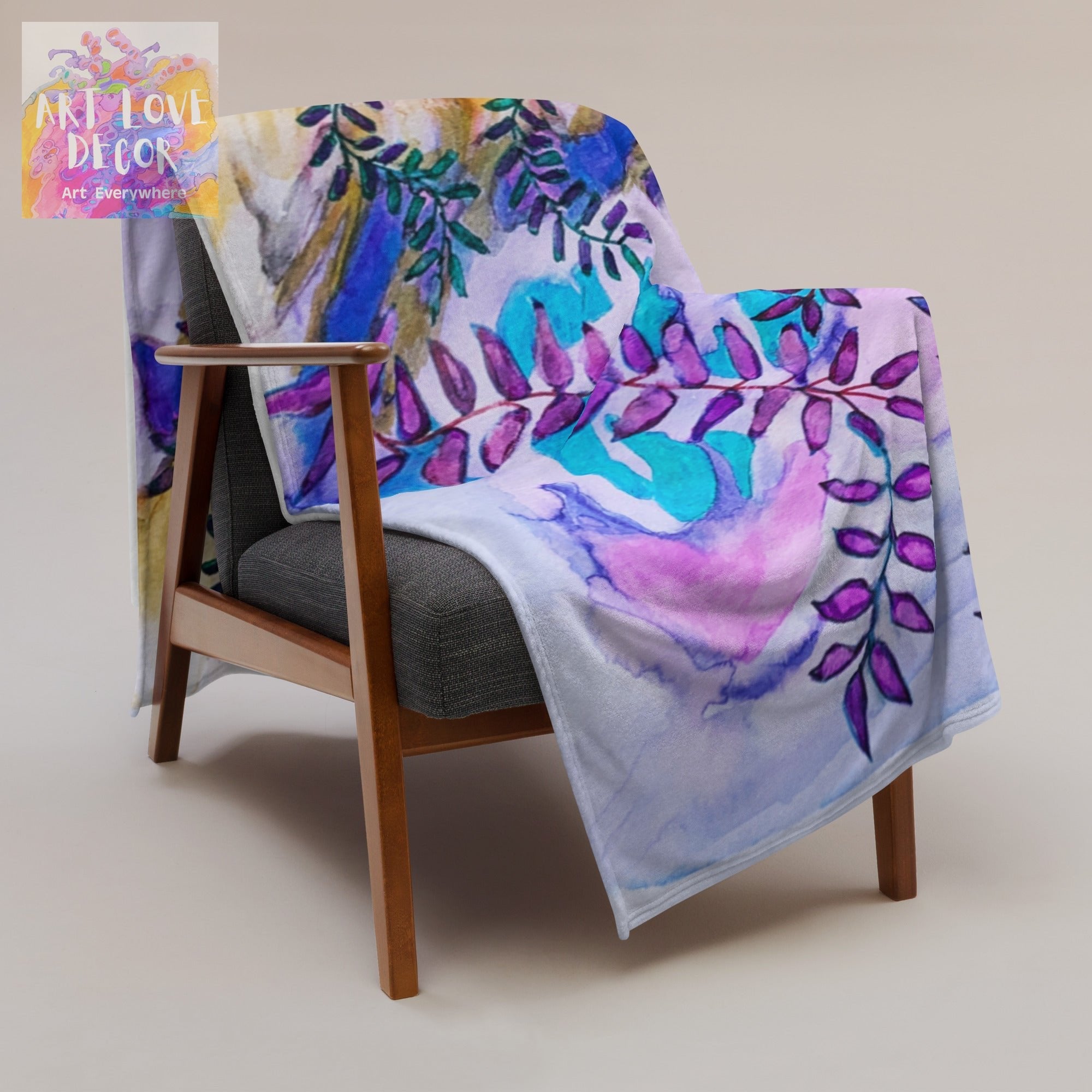 Blue Rocks Leaves Throw Blanket with colorful leaf design draped on chair